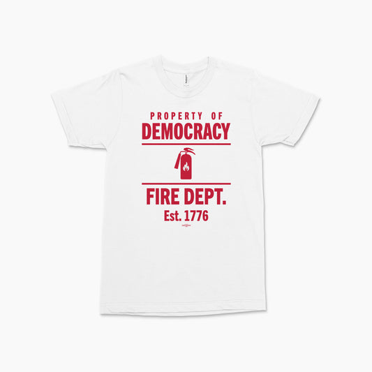 White V-neck T-shirt with red text "Property of Democracy Fire Dept. Est. 1776" and fire extinguisher graphic centered on.