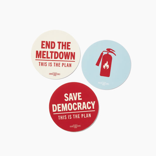 Set of three round stickers with political messages in red, white, and blue colors.