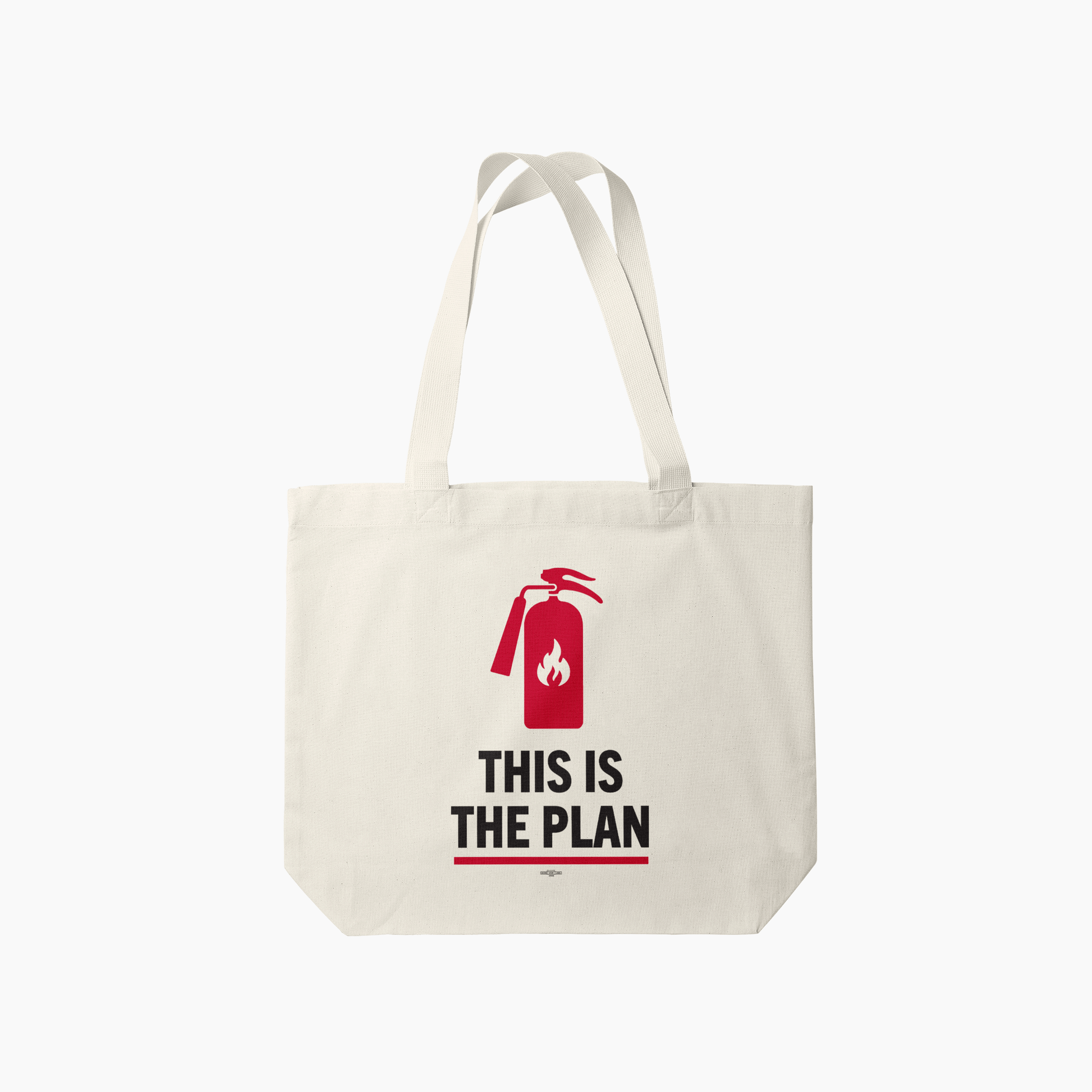 Cream canvas tote bag with red fire extinguisher graphic and bold text "THIS IS THE PLAN".
